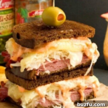 Spicy Reuben Sandwich sliced in half and stacked.