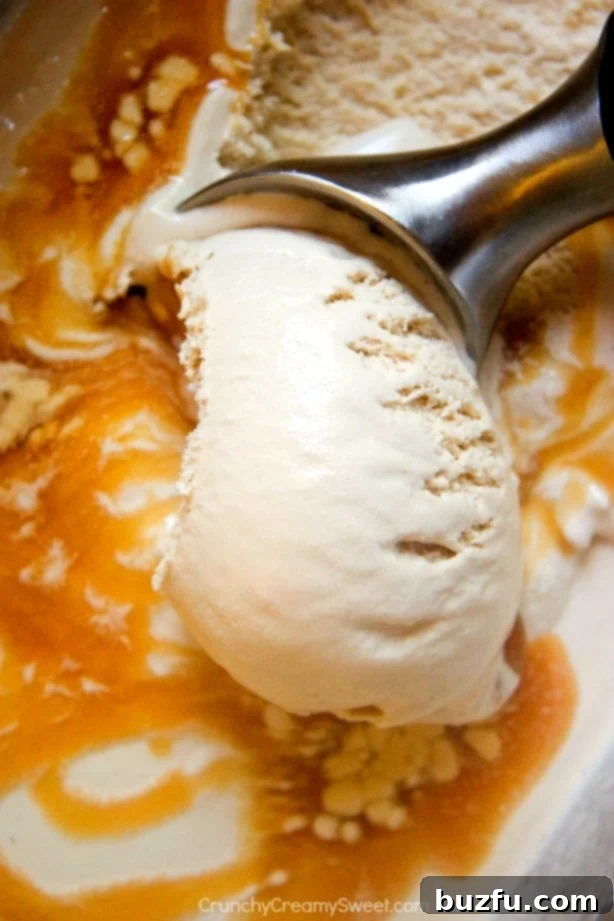 Homemade Caramel Iced Coffee Ice Cream A scoop of homemade Caramel Iced Coffee Ice Cream in a bowl, drizzled with extra caramel sauce.