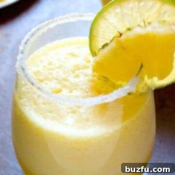 Fresh Pineapple Margarita in a glass, ready to be enjoyed.