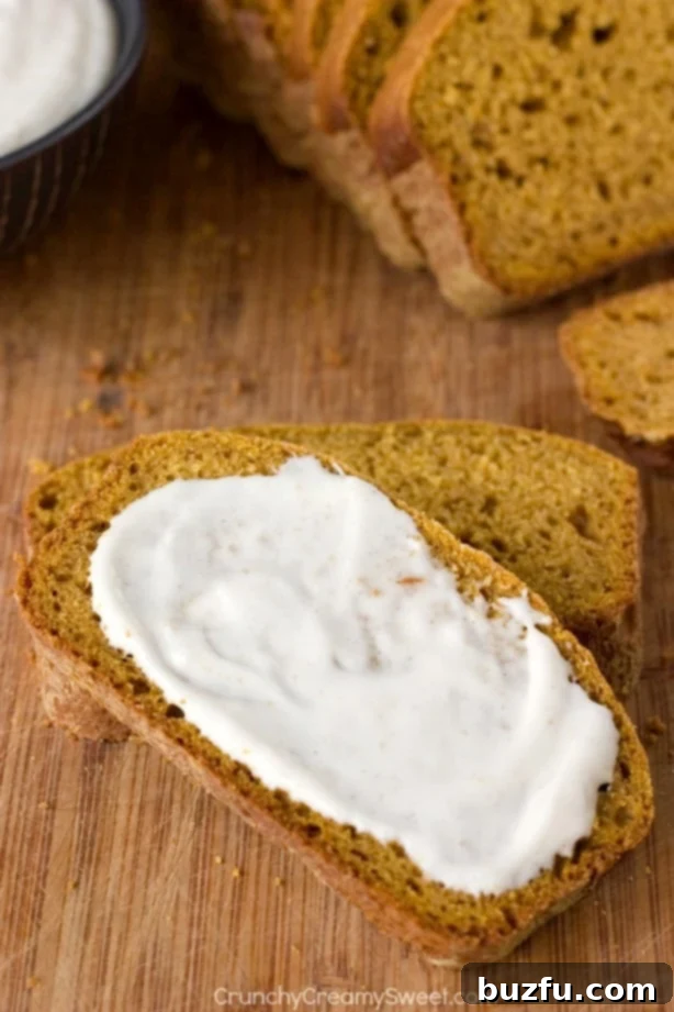 Pumpkin Bread slices arranged on a serving plate, showcasing its moist texture and golden-brown crust.