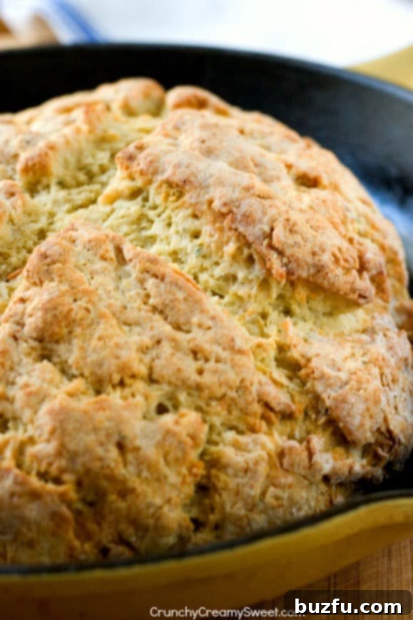 Parmesan Ranch Skillet Bread 2 Close-up of freshly baked Parmesan Ranch Skillet Bread, showing the perfectly textured, golden-brown top before slicing.
