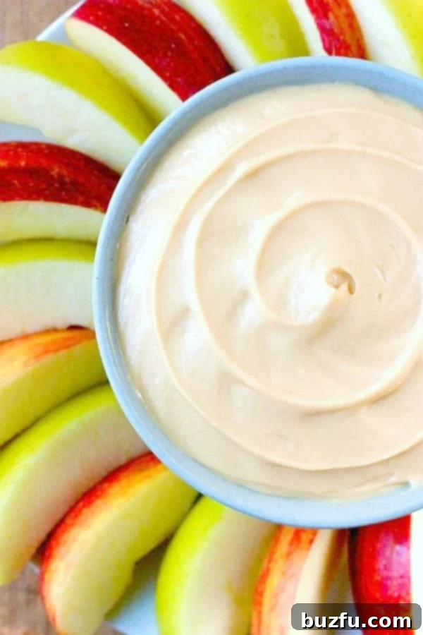 Irresistible 2-Ingredient Caramel Apple Dip: Quick, Easy, and Perfect for Any Occasion! Creamy Caramel Apple Dip served in a rustic bowl, surrounded by fresh apple slices ready for dipping. A perfect quick snack or party treat.