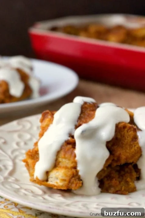 Cozy Pumpkin Orange Bread Pudding with Tangy Cream Cheese Glaze 4 Warm Pumpkin Orange Bread Pudding with Cream Cheese Glaze ready to be served