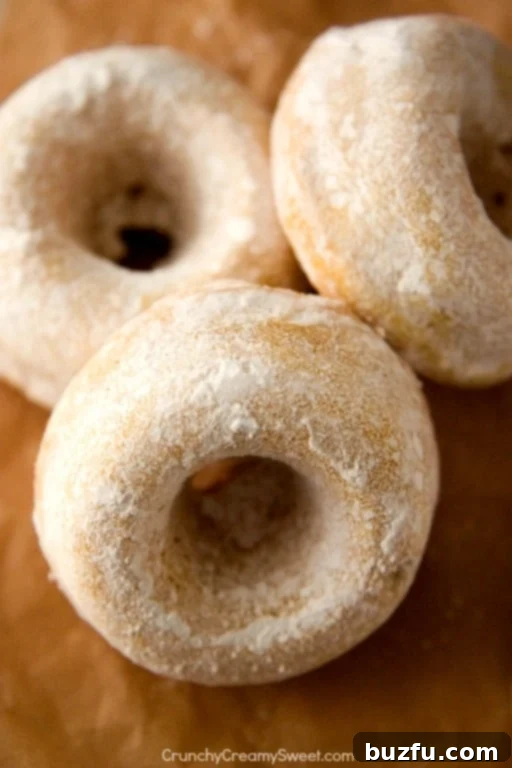 Mini Powdered Sugar Donuts piled high in a bowl