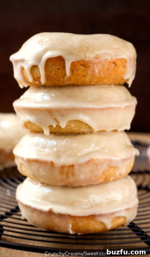 Fluffy Baked Donuts with Maple Glaze dripping