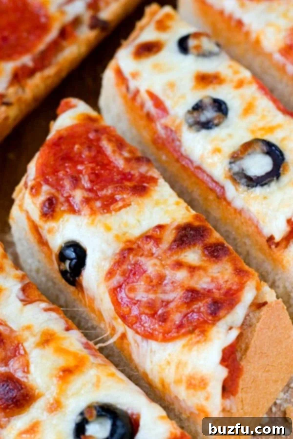 Freshly baked Easy Pizza Bread, sliced and garnished, showcasing its golden crust and melted cheese