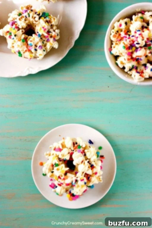 Sweet & Salty Confetti Pop Donuts 3 Festive Birthday Popcorn Donuts topped with sprinkles and white chocolate.