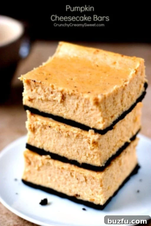 Pumpkin Cheesecake Bars - delicious and creamy pumpkin dessert for cheesecake lovers. You will love the flavors of fall in these bars!