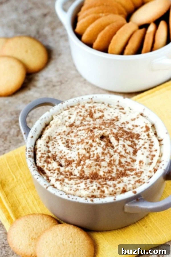 Tiramisu Dip in a elegant bowl, surrounded by crispy vanilla wafers, ready for dipping.