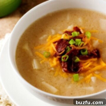 Slow Cooker Baked Potato Soup in a rustic bowl