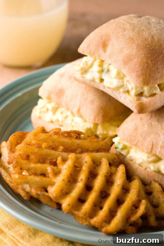 Skinny Egg Salad Sliders served with Alexia Waffle Fries, a healthy and kid-friendly meal.