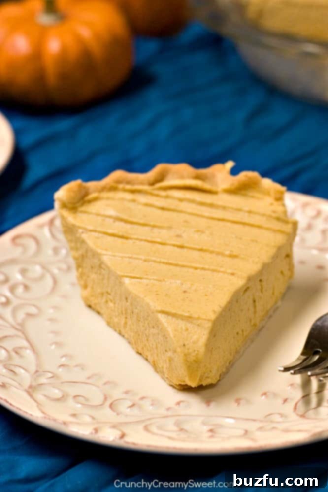 A whole Pumpkin Mousse Pie, freshly chilled and ready to serve, symbolizing a convenient and delicious holiday dessert solution.
