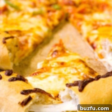 A perfectly baked Stuffed Crust Pizza resting on a rustic wooden board, ready to be sliced and served.