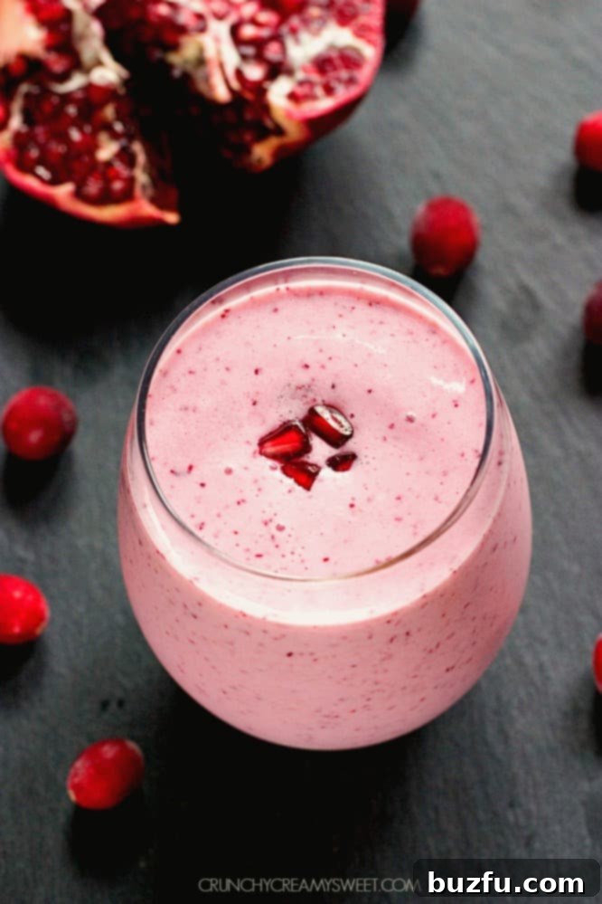 Power smoothie with pomegranate and cranberries, close up of vibrant texture