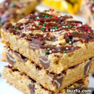 Mint Chocolate Chip Cookie Bars stacked up on a plate.