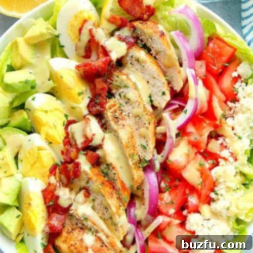 Dill Pickle Chicken Salad Delight 8 Cobb salad with chicken and bacon in a bowl.